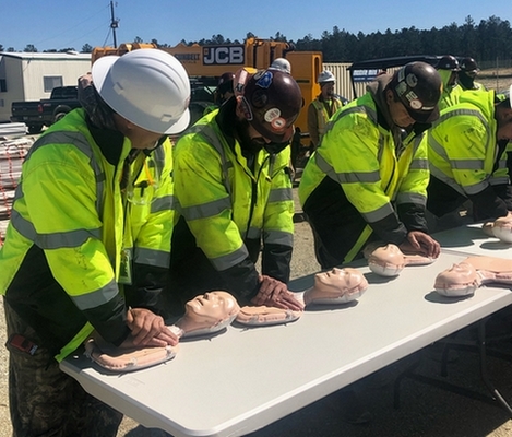 Four Construction Workers Learning CPR